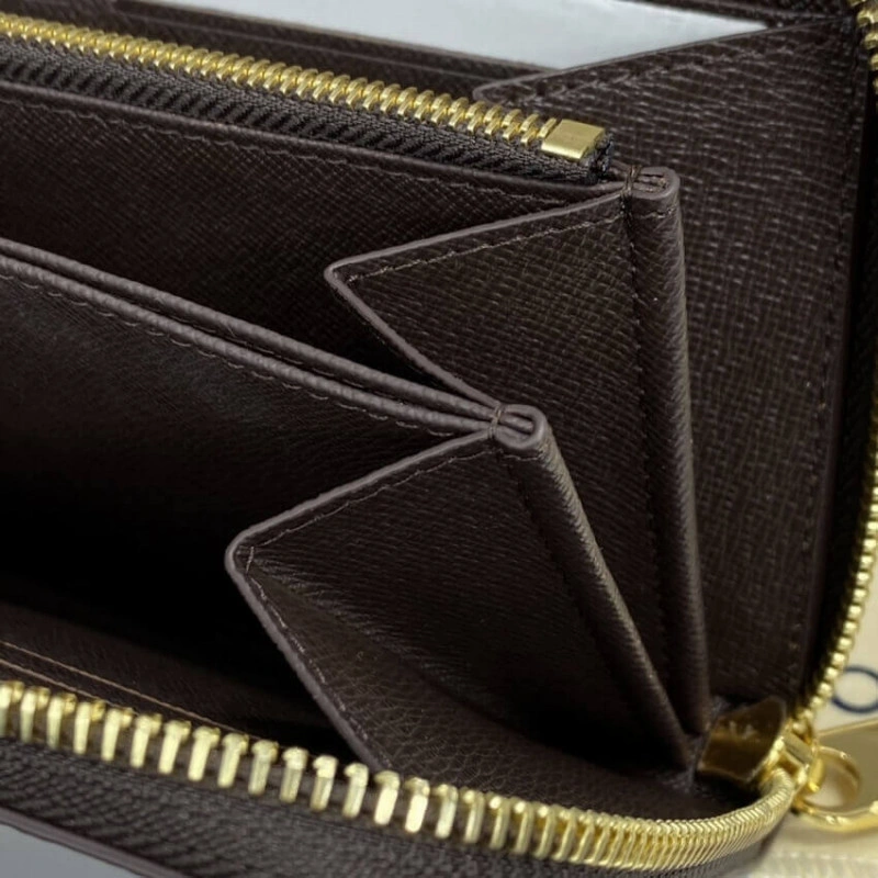 This iconi Louis Vuitton Damier Ebene Zippy Wallet Brown - Image 8