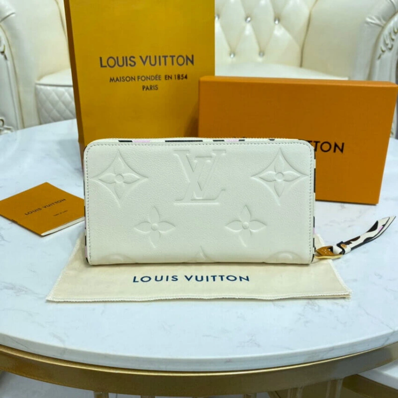 Louis Vuitton Monogram Empreinte Leather with Animal-Print Zippy Wallet Cream - Image 4